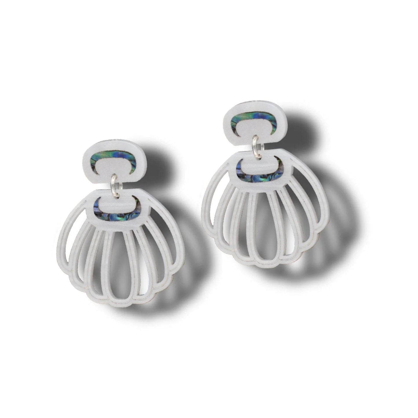 A pair of pearl acrylic Shell Woman earrings from Copper Canoe Woman.