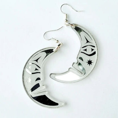 silver acrylic crescent moon engraved with formline art from copper canoe woman