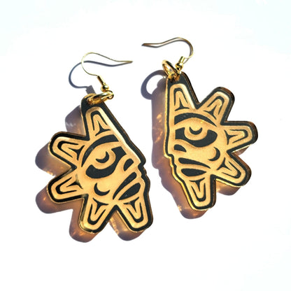 A pair of "Balance Sun" earrings in gold mirror acrylic from Copper Canoe Woman.