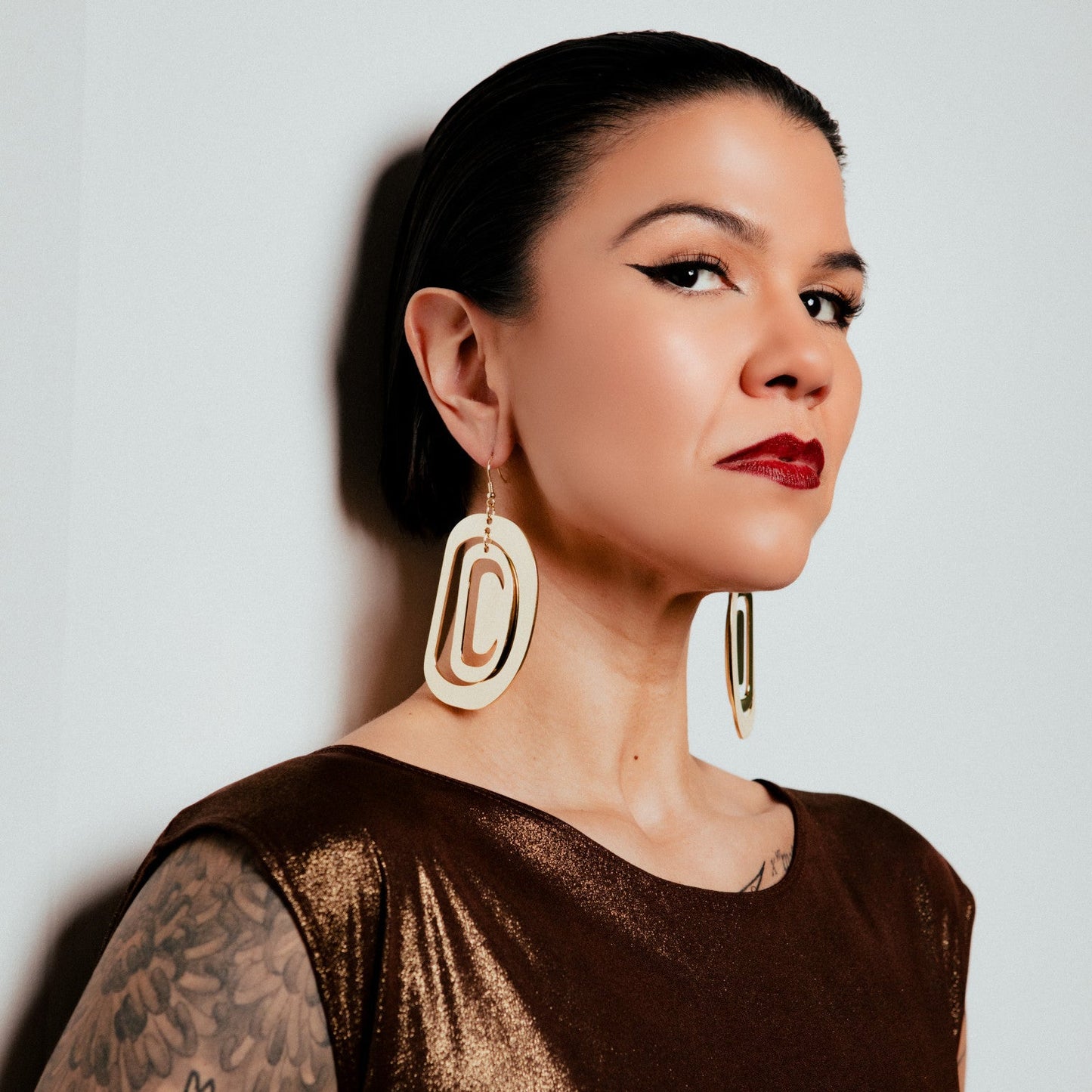 large ovoid earring gold metal crescent cutout
