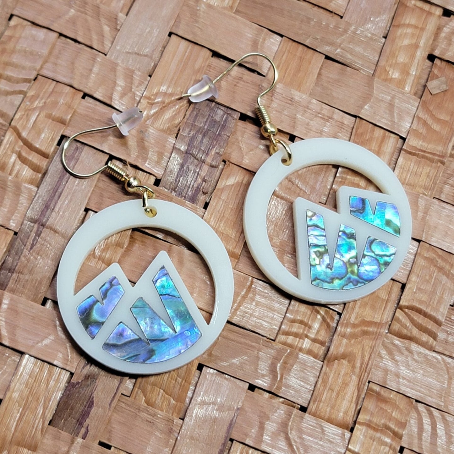 ivory acrylic earring with mountain cut out and abalone inlay from copper canoe woman