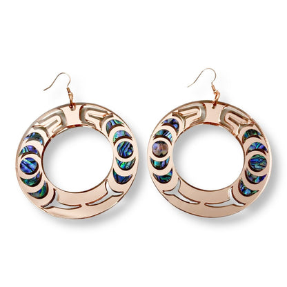 A pair of rose gold mirror acrylic Nala Hoop earrings from Copper Canoe Woman.