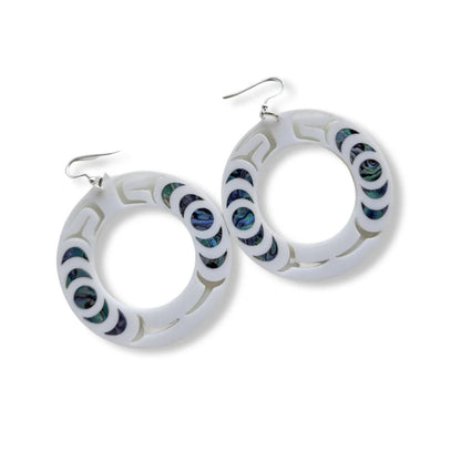 A pair of white acrylic "Nala Hoop" earrings from Copper Canoe Woman.