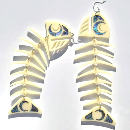 Large ivory acrylic salmon ghost earrings from Copper Canoe Woman on a white background.