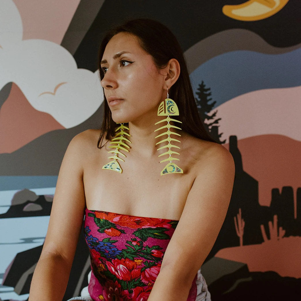 Model wearing neon pear acrylic large salmon ghost earrings from Copper Canoe Woman.